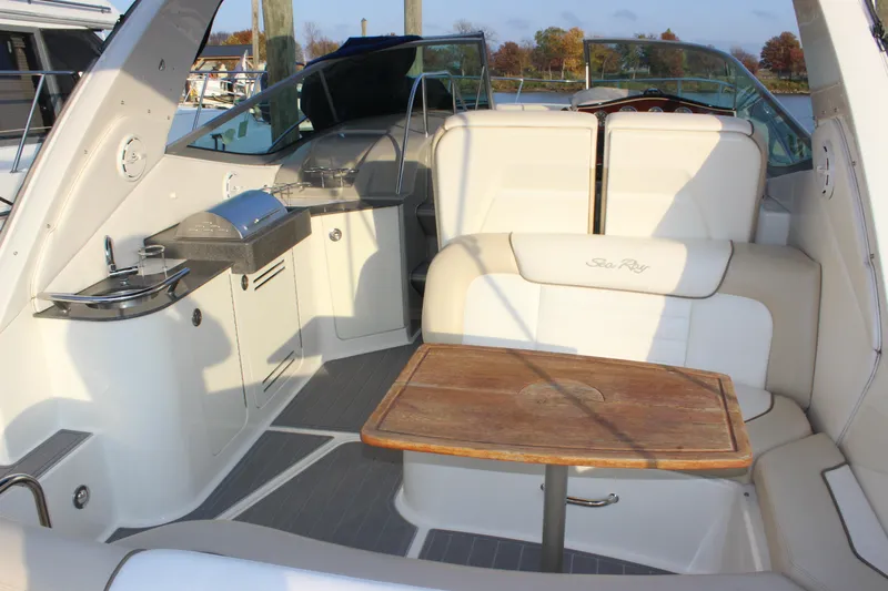  Yacht Photos Pics Interior of 2012 Sea Ray 330 Sundancer with seating and kitchenette.