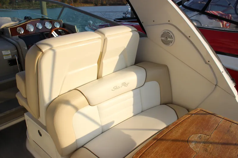  Yacht Photos Pics 2012 Sea Ray 330 Sundancer interior with beige seating and wooden table.