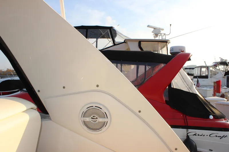  Yacht Photos Pics 2012 Sea Ray 330 Sundancer boat docked, featuring a speaker and nearby vessels.