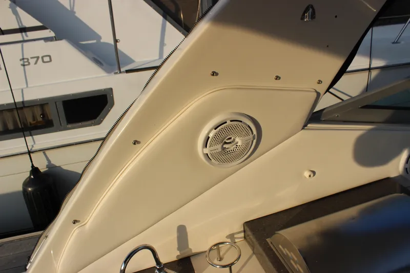  Yacht Photos Pics 2012 Sea Ray 330 Sundancer boat interior with speaker and control panel.