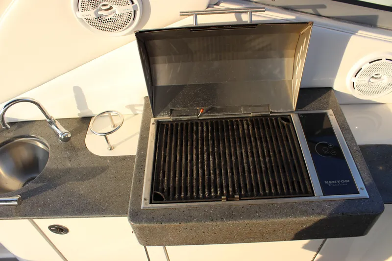  Yacht Photos Pics Outdoor grill and sink on 2012 Sea Ray 330 Sundancer boat deck.