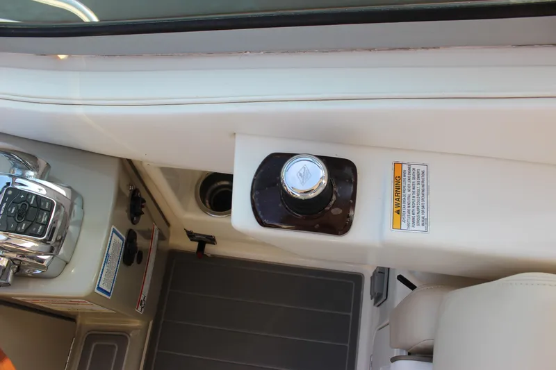  Yacht Photos Pics 2012 Sea Ray 330 Sundancer cockpit controls with warning label and throttle.