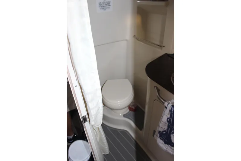  Yacht Photos Pics 2012 Sea Ray 330 Sundancer bathroom interior with toilet and countertop.