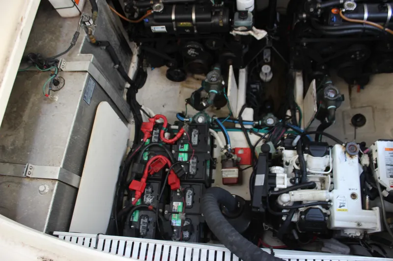  Yacht Photos Pics Engine compartment of 2012 Sea Ray 330 Sundancer with visible batteries and mechanical components.