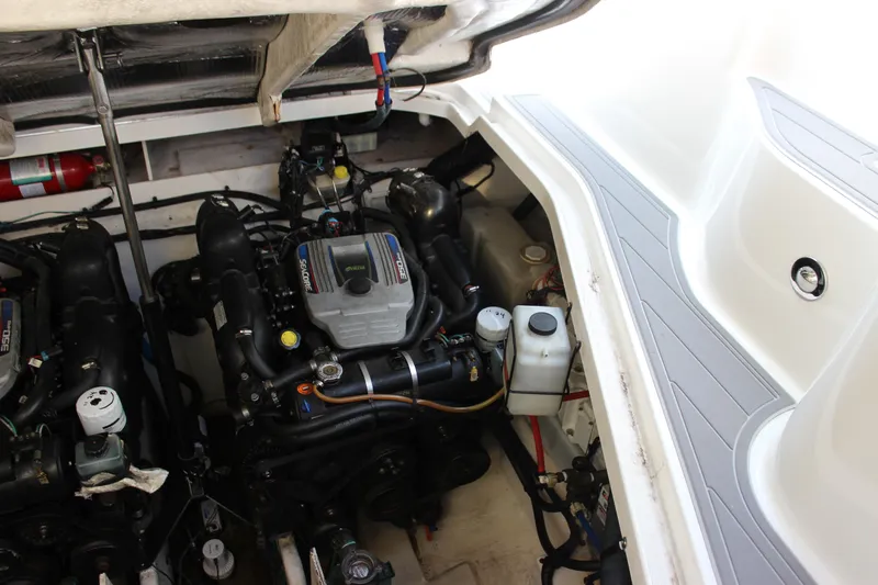  Yacht Photos Pics Engine compartment of 2012 Sea Ray 330 Sundancer boat, showcasing dual engines and components.