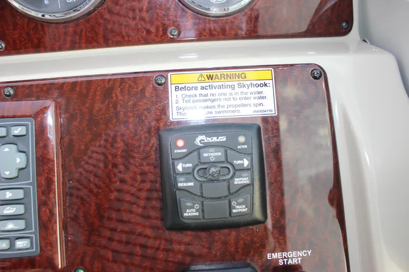  Yacht Photos Pics Control panel of 2012 Sea Ray 330 Sundancer with Skyhook warning label.