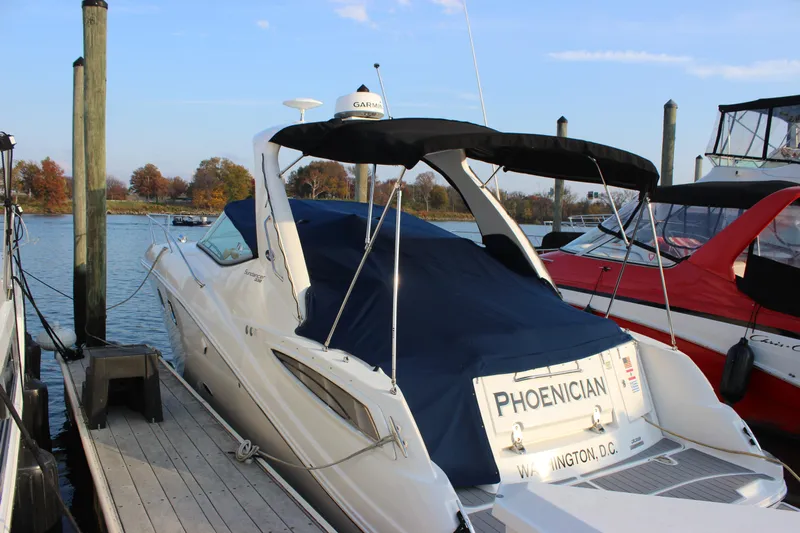  Yacht Photos Pics 2012 Sea Ray 330 Sundancer docked, covered, with "Phoenician" nameplate, Washington D.C. registration.