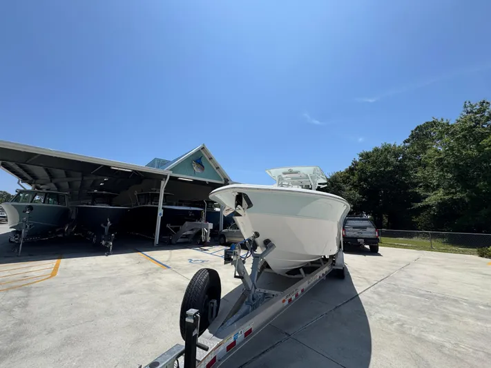  Yacht Photos Pics 2022 Sea Fox 288 Commander boat on trailer under clear blue sky.