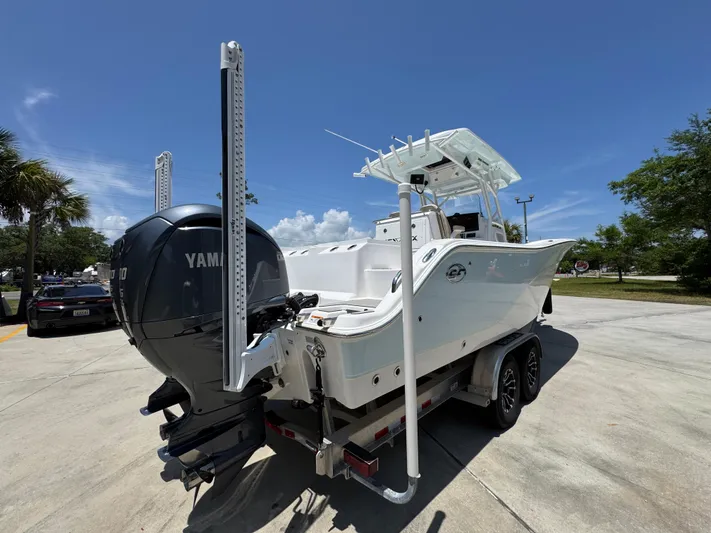  Yacht Photos Pics 2022 Sea Fox 288 Commander boat with Yamaha engine on trailer, parked outdoors.