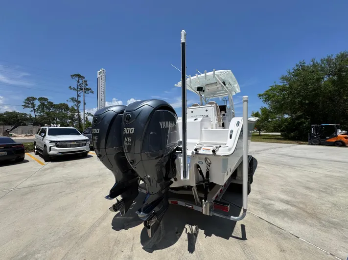  Yacht Photos Pics 2022 Sea Fox 288 Commander boat with dual Yamaha 300 engines, parked outdoors.