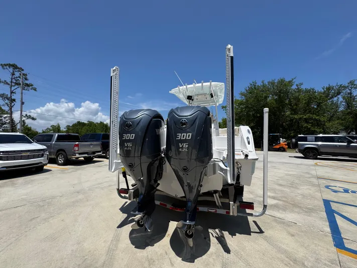  Yacht Photos Pics 2022 Sea Fox 288 Commander boat with dual 300 V6 engines in a parking lot.