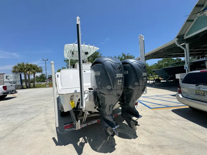  Yacht Photos Pics 2022 Sea Fox 288 Commander with dual Yamaha 300 engines in a sunny marina setting.