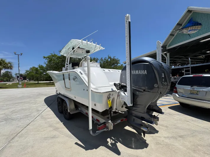  Yacht Photos Pics 2022 Sea Fox 288 Commander boat with Yamaha engine on trailer, parked outdoors.