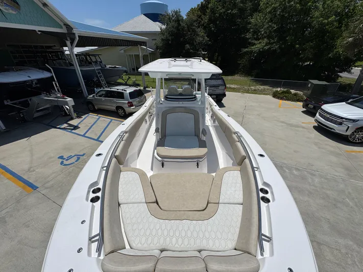  Yacht Photos Pics 2022 Sea Fox 288 Commander boat with spacious seating, parked outdoors.