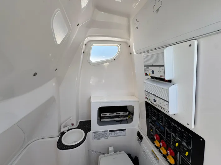  Yacht Photos Pics Interior of 2022 Sea Fox 288 Commander boat, featuring control panels and compact amenities.