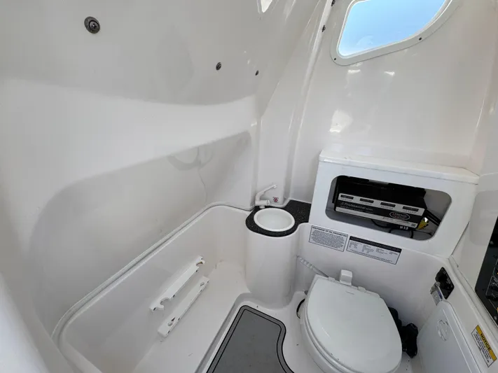  Yacht Photos Pics 2022 Sea Fox 288 Commander boat interior with toilet and storage compartment.