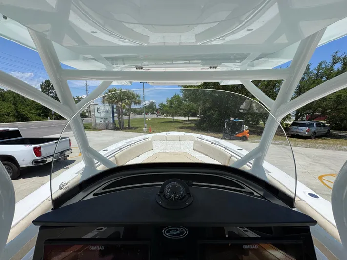  Yacht Photos Pics 2022 Sea Fox 288 Commander boat interior with helm view and windshield.