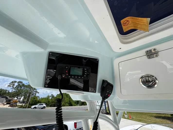  Yacht Photos Pics 2022 Sea Fox 288 Commander boat interior with radio and storage compartment.