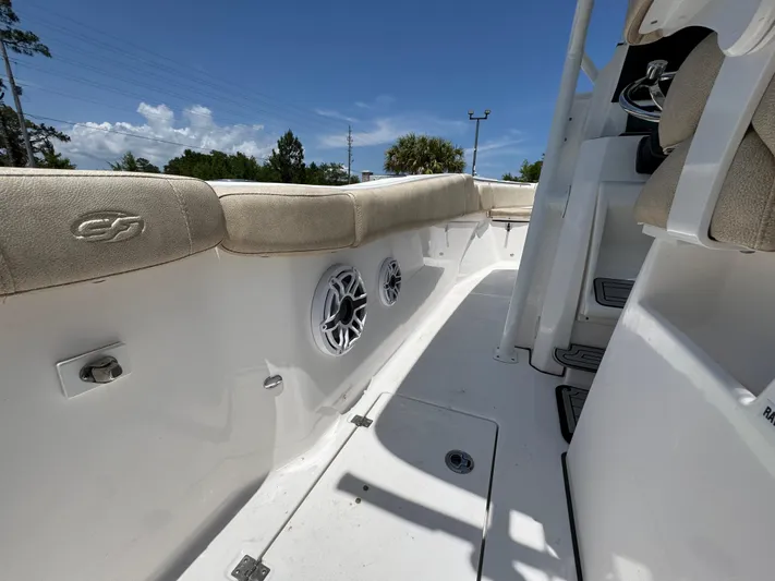  Yacht Photos Pics 2022 Sea Fox 288 Commander boat interior with cushioned seating and built-in speakers.
