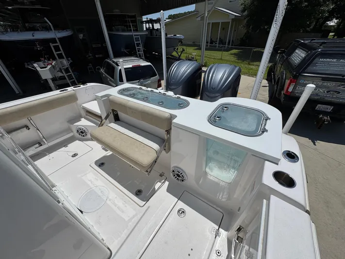  Yacht Photos Pics 2022 Sea Fox 288 Commander boat deck with seating and storage compartments.