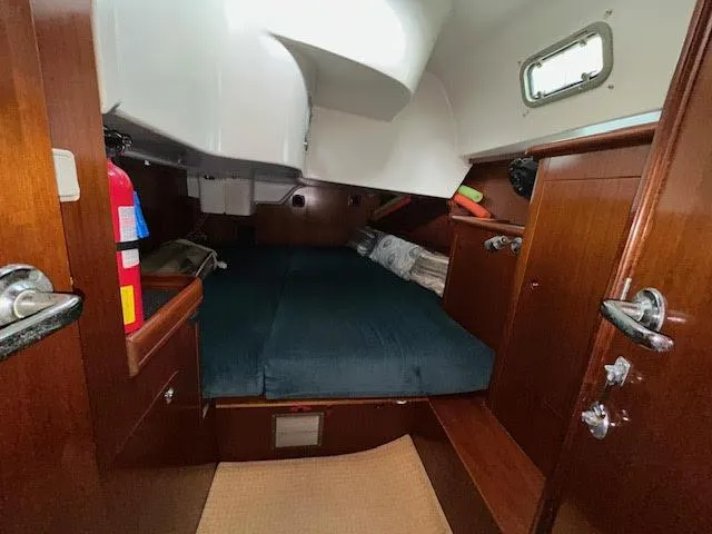 Walkabout Yacht Photos Pics Cozy cabin interior of 1997 Beneteau Oceanis 461 sailboat with wooden finish.