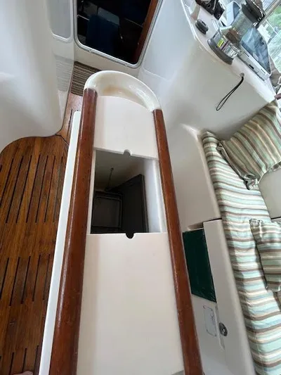 Walkabout Yacht Photos Pics Interior view of 1997 Beneteau Oceanis 461 sailboat, featuring wooden flooring and seating area.