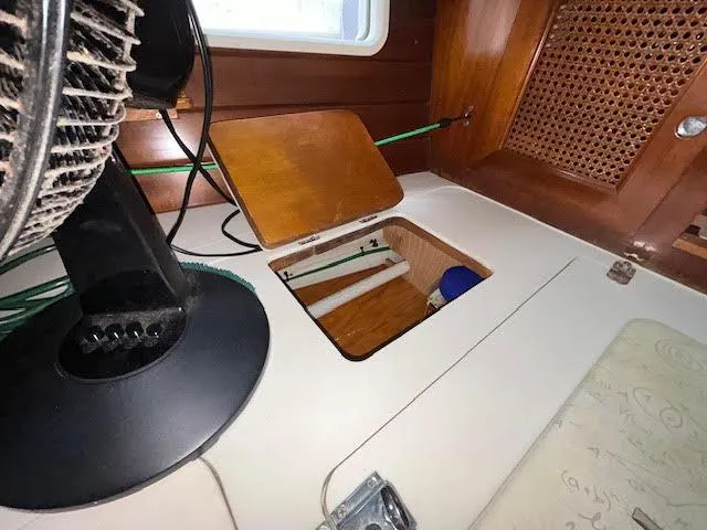 Walkabout Yacht Photos Pics Interior of 1997 Beneteau Oceanis 461 yacht with open storage compartment.