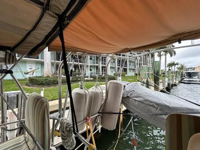 Walkabout Yacht Photos Pics Beneteau Oceanis 461 sailboat docked, covered, with waterfront view, 1997 model.