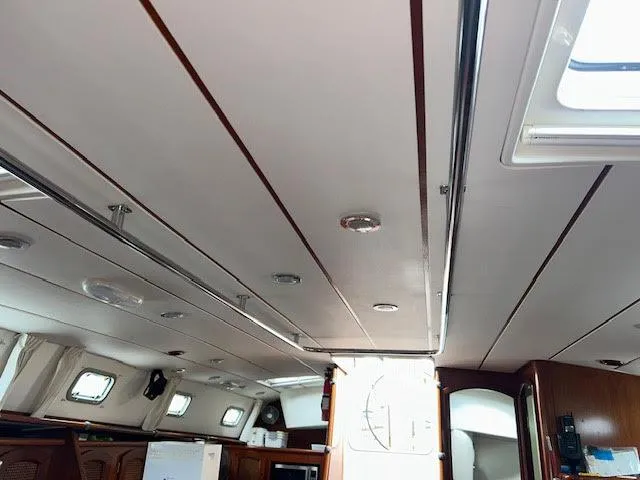 Walkabout Yacht Photos Pics Interior view of 1997 Beneteau Oceanis 461 sailboat, featuring sleek ceiling design and windows.
