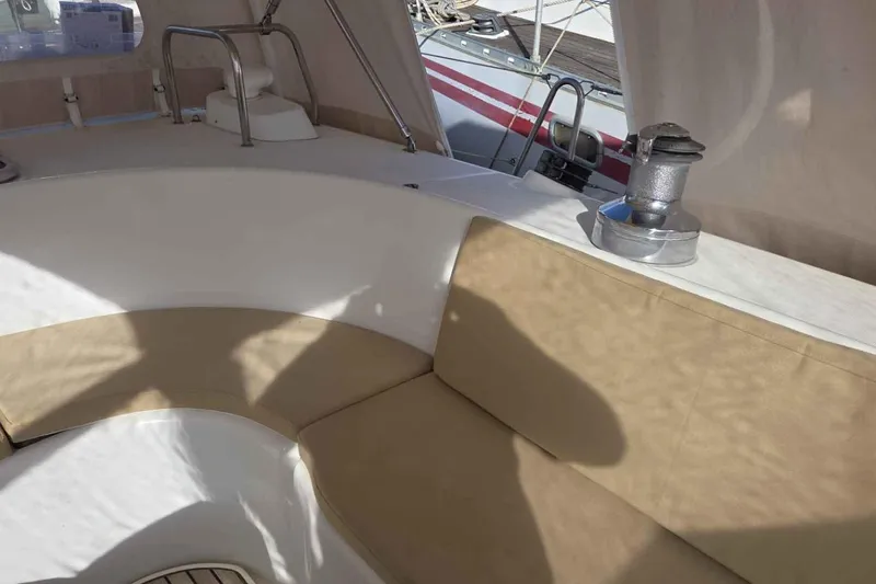 My Way Yacht Photos Pics 2004 Beneteau Oceanis 42CC cockpit with beige seating and winch, docked at marina.