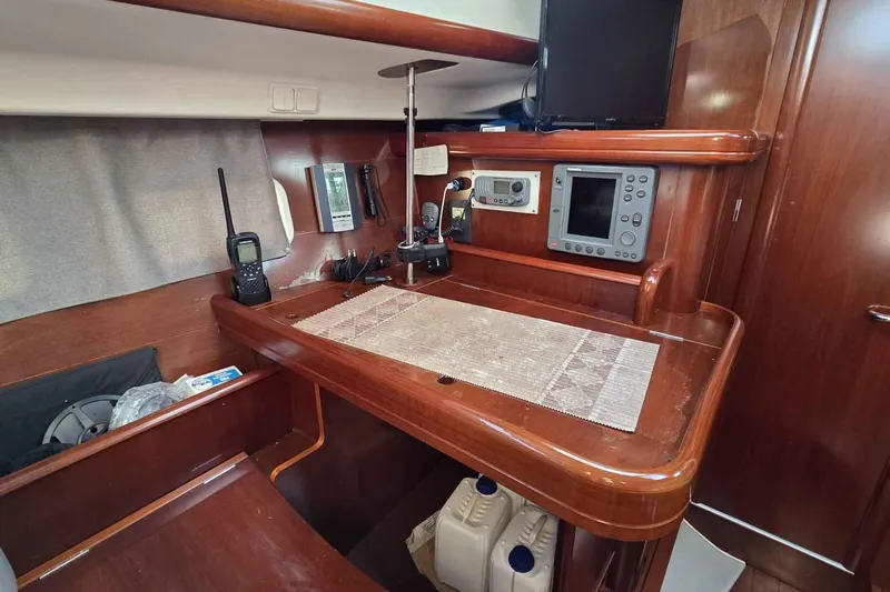 My Way Yacht Photos Pics Navigation station in 2004 Beneteau Oceanis 42CC yacht with electronics and wooden finish.