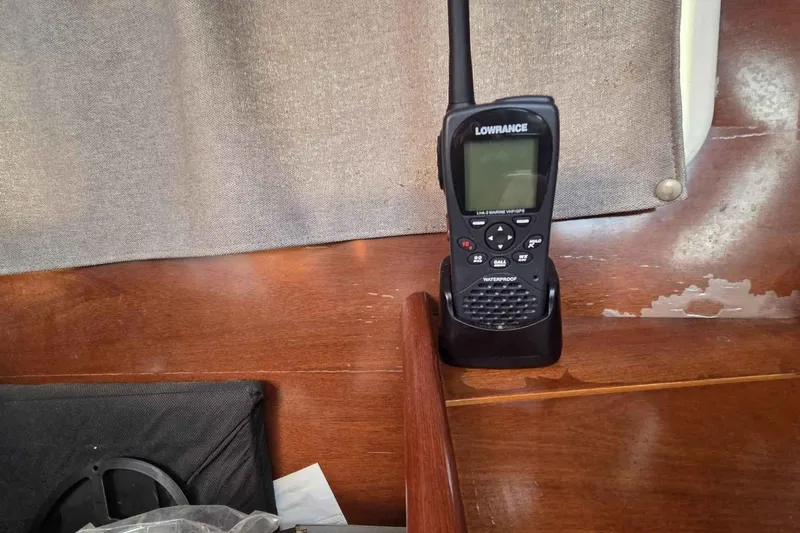 My Way Yacht Photos Pics Handheld marine radio on Beneteau Oceanis 42CC yacht, 2004 model, with wooden interior.