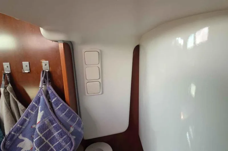 My Way Yacht Photos Pics Interior of 2004 Beneteau Oceanis 42CC yacht with hooks and towels.