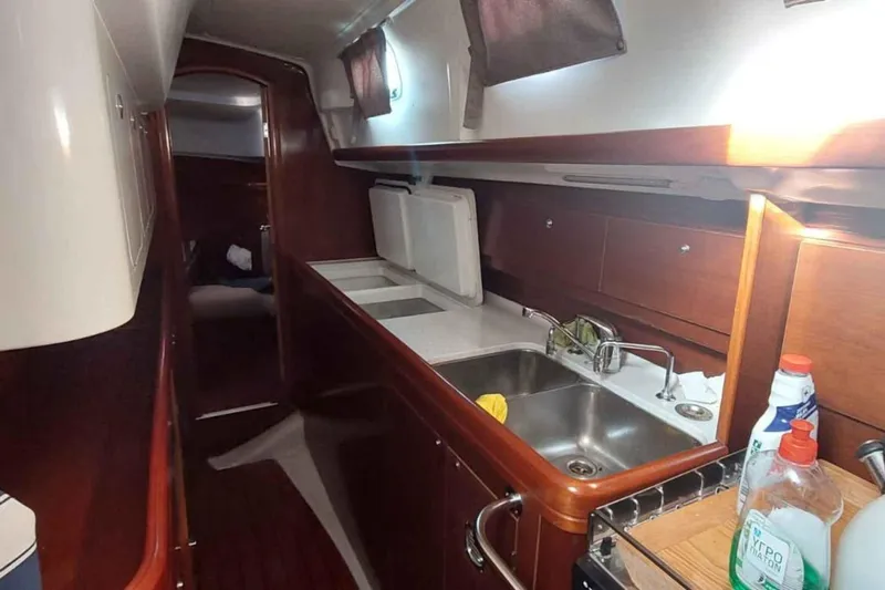 My Way Yacht Photos Pics Interior of 2004 Beneteau Oceanis Clipper 44 CC yacht kitchen with sink and storage.