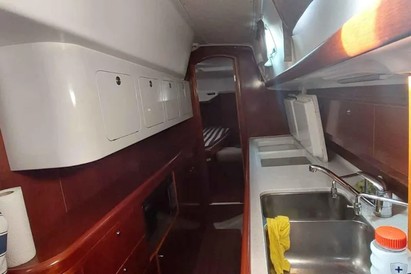 My Way Yacht Photos Pics 2004 Beneteau Oceanis Clipper 44 CC yacht interior with kitchen and storage cabinets.