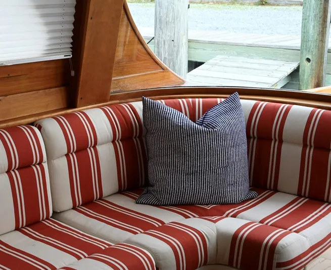 Carol Anne Yacht Photos Pics Interior of 2007 Hinckley Talaria 44 MY with striped seating and decorative pillow.
