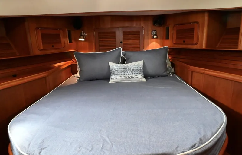 Carol Anne Yacht Photos Pics Luxurious cabin interior of 2007 Hinckley Talaria 44 MY with cozy bedding.