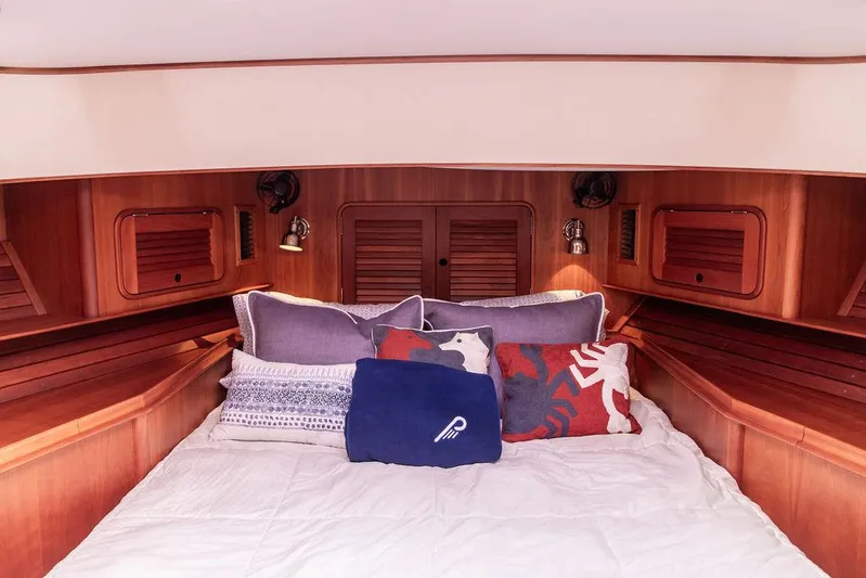 Carol Anne Yacht Photos Pics Luxurious cabin interior of 2007 Hinckley Talaria 44 MY yacht with cozy bedding.