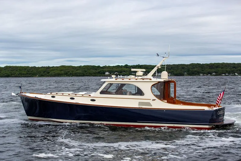 Carol Anne Yacht Photos Pics 2007 Hinckley Talaria 44 MY yacht cruising on a scenic waterway.