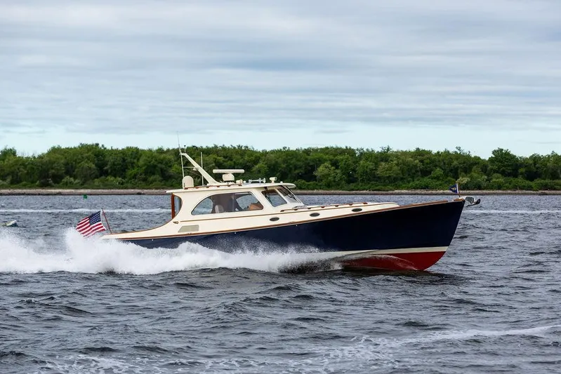 Carol Anne Yacht Photos Pics 2007 Hinckley Talaria 44 MY cruising on open water with American flag.