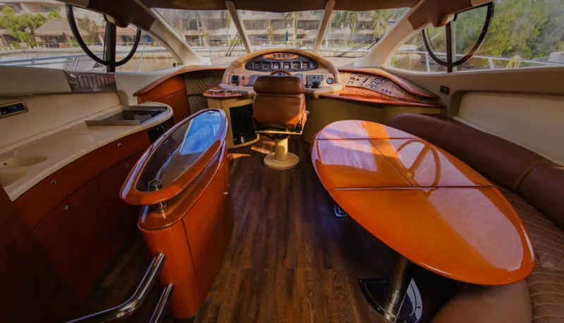 Belle Yacht Photos Pics Luxurious interior of a 2004 Azimut 55E yacht with elegant wood finishes and modern design.