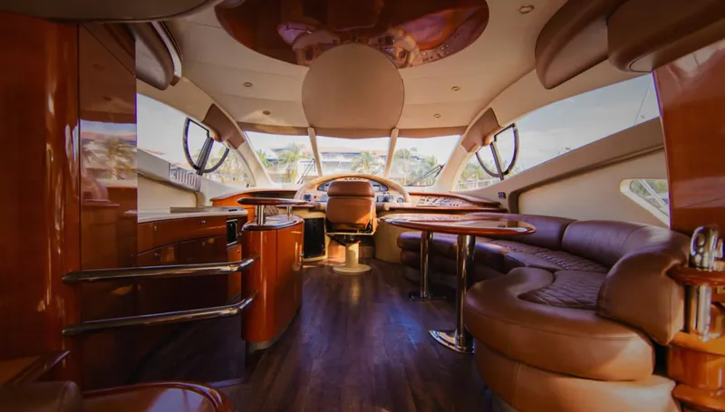 Belle Yacht Photos Pics Luxurious interior of a 2004 Azimut 55E yacht with elegant wood and leather furnishings.