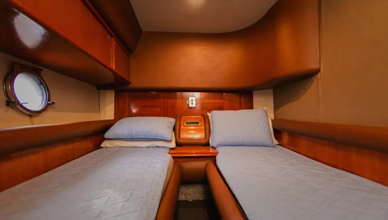 Belle Yacht Photos Pics Luxurious twin cabin interior of 2004 Azimut 55E yacht with wooden finishes.