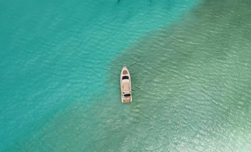 Belle Yacht Photos Pics Aerial view of 2004 Azimut 55E yacht on turquoise water.