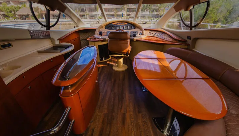 Belle Yacht Photos Pics Luxurious interior of a 2004 Azimut 55E yacht with elegant wood finishes.