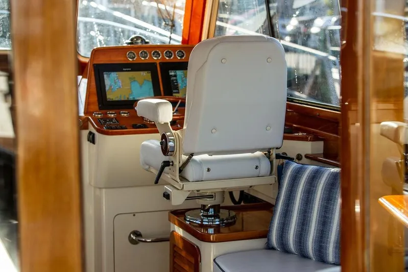 Mon Amour Yacht Photos Pics Helm of 2005 Hinckley Talaria 44 yacht with navigation screens and captain's chair.