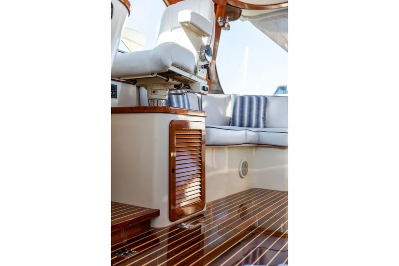 Mon Amour Yacht Photos Pics Luxurious interior of 2005 Hinckley Talaria 44 yacht with polished wood and plush seating.
