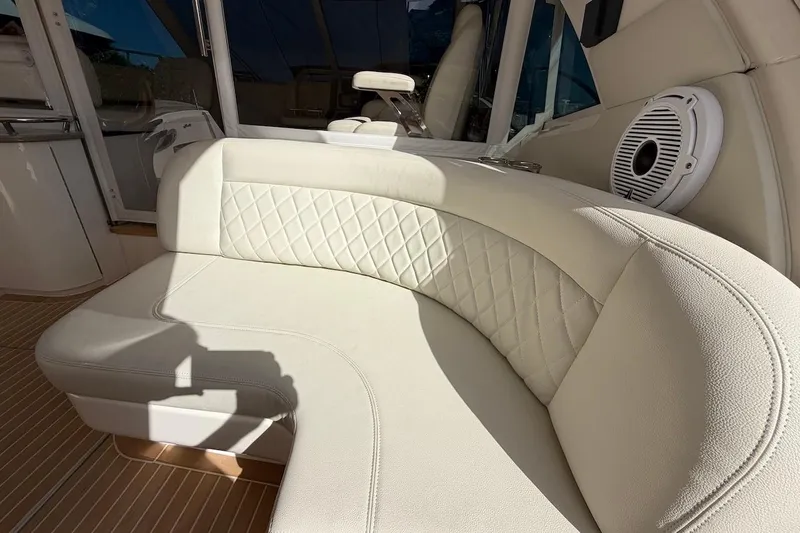  Yacht Photos Pics Luxurious white seating on 2006 Sea Ray 48 Sundancer yacht, featuring quilted upholstery and speaker.
