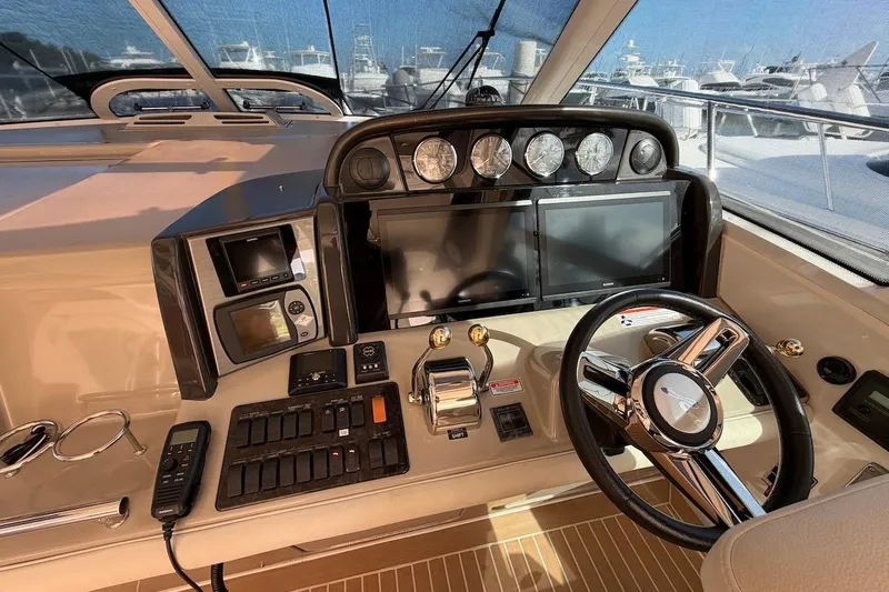 Yacht Photos Pics Helm of 2006 Sea Ray 48 Sundancer with modern navigation controls and steering wheel.