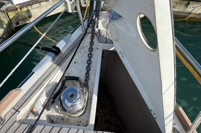 Adattare Yacht Photos Pics Beneteau Oceanis 45 (2012) anchor locker with chain and winch, dockside view.